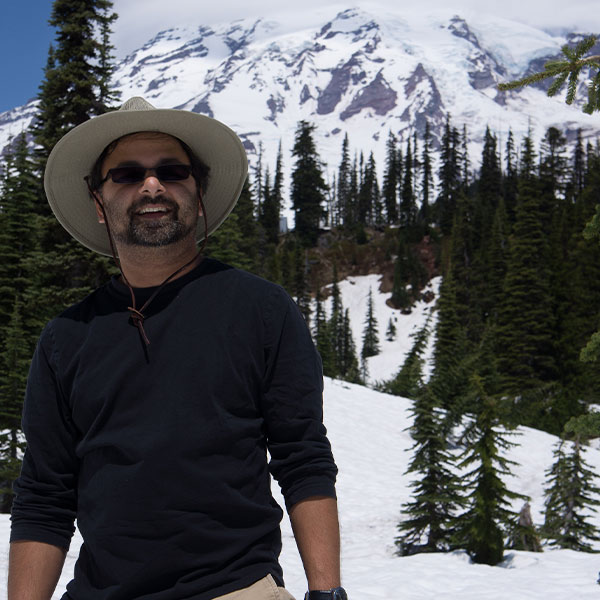 Deven Desai in front of Mount Rainier