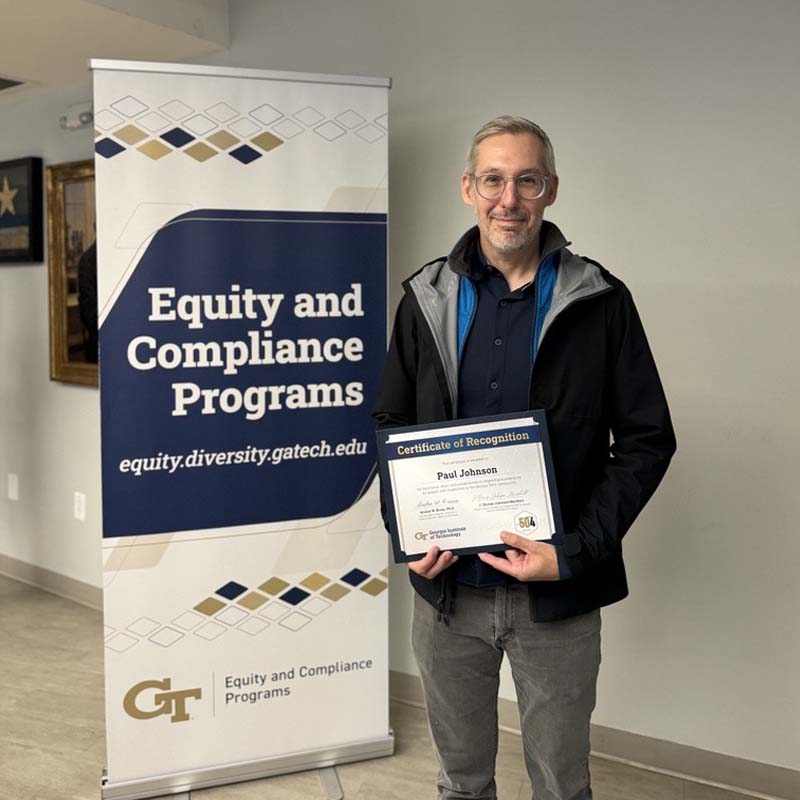 Paul Johnson holds Advocates for Accessibility awards certificate in front of Georgia Tech Equity and Compliance Programs banner.