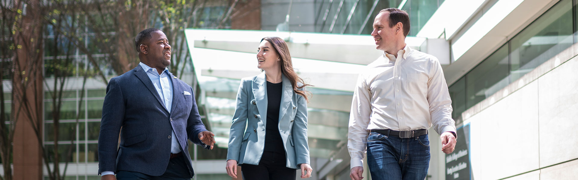 Image of emba students walking together in front of Scheller