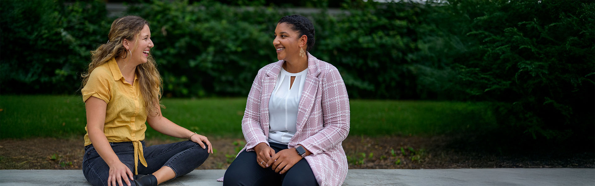 Two female Scheller students chatting outside