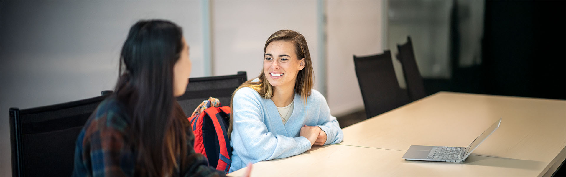 Two female students in meeting