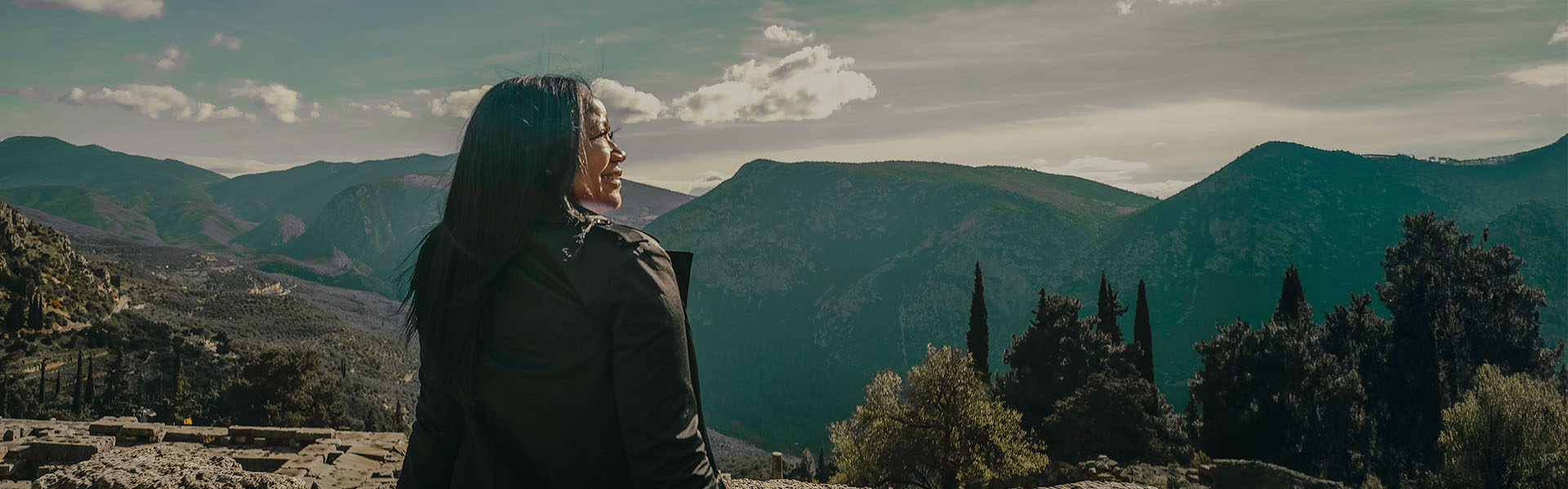 woman looking out over mountain view