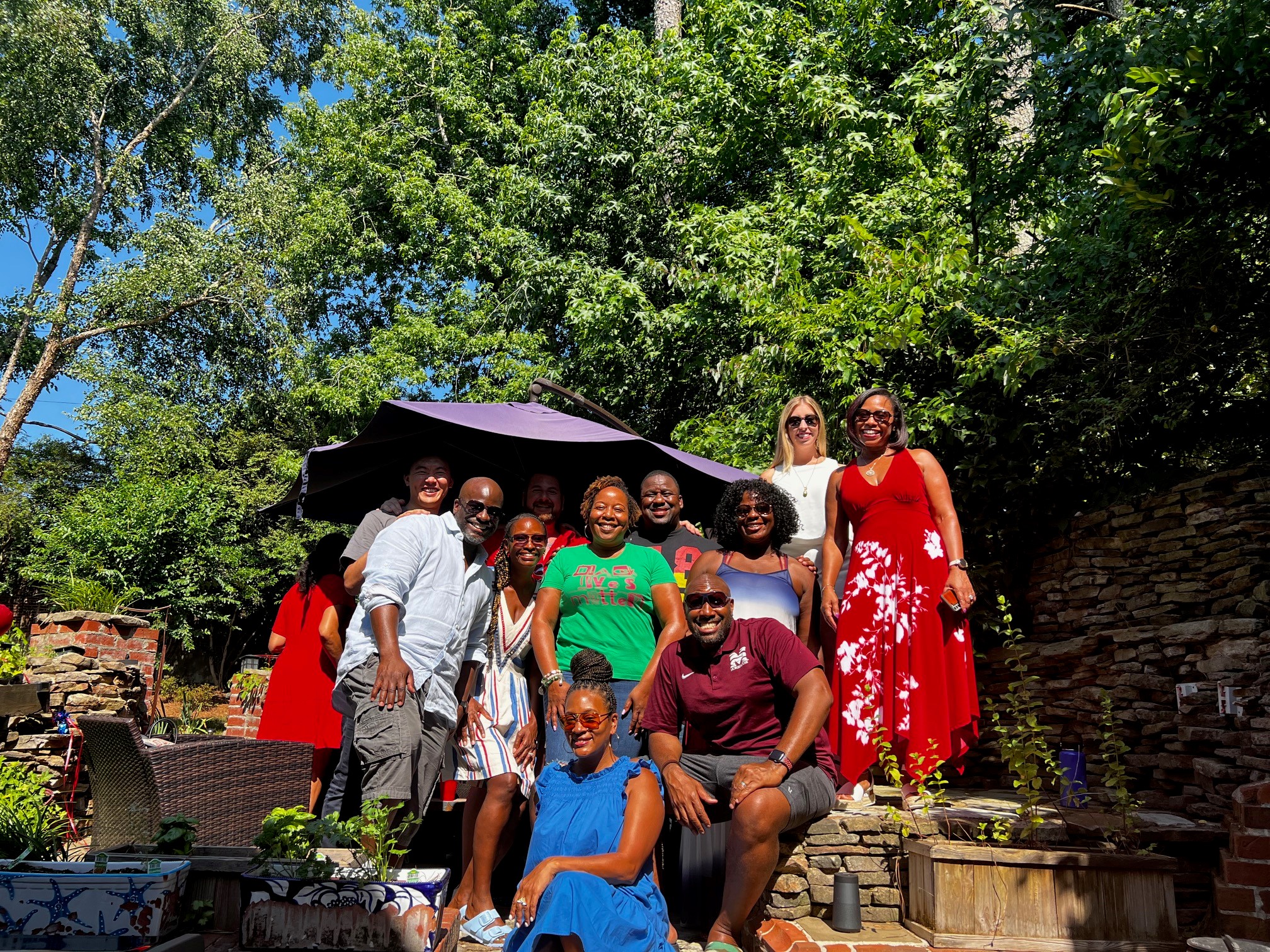 A group of Scheller MBA alumni. Jamaal is standing on the left and Duane is sitting on the right.