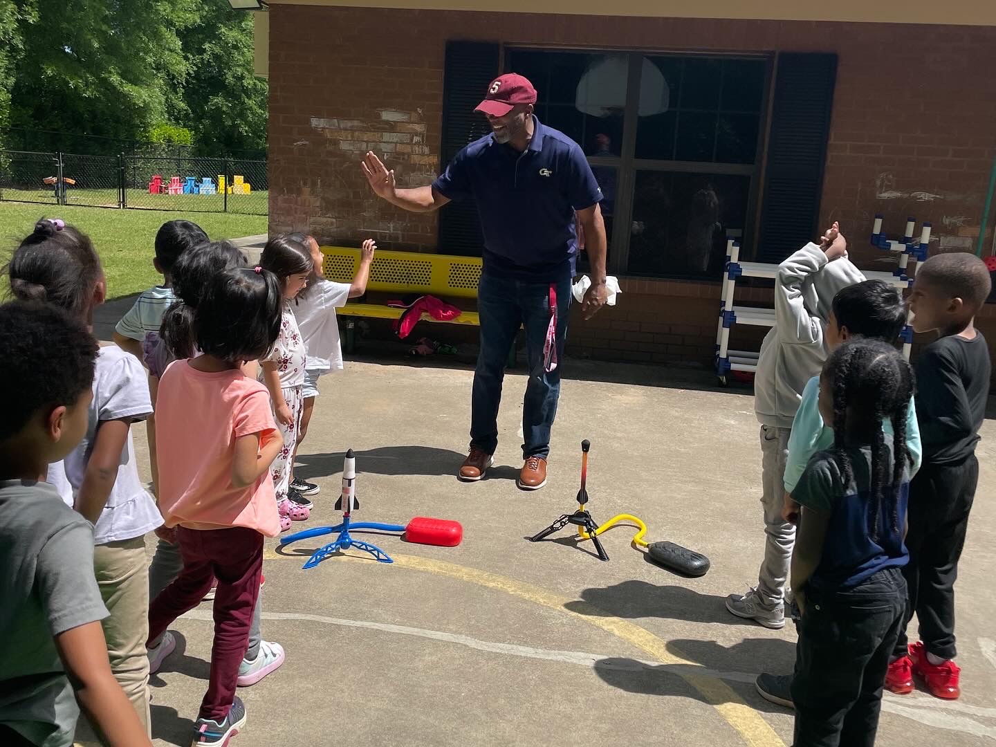 Jay Elliott volunteering at his son's school where he hosted a "Space Day" to get the kids excited about STEM and Georgia Tech.
