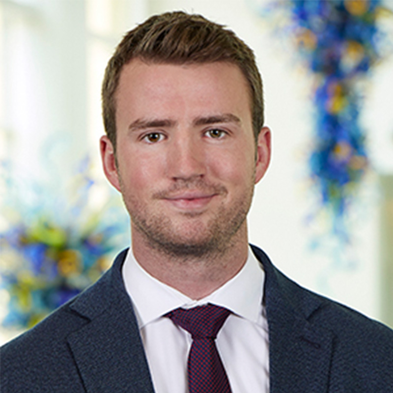 Full-time MBA student John Ross smiles in a professional headshot