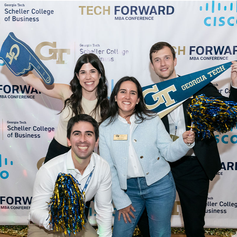 MBA students taking a photo at the TechForward Conference. 