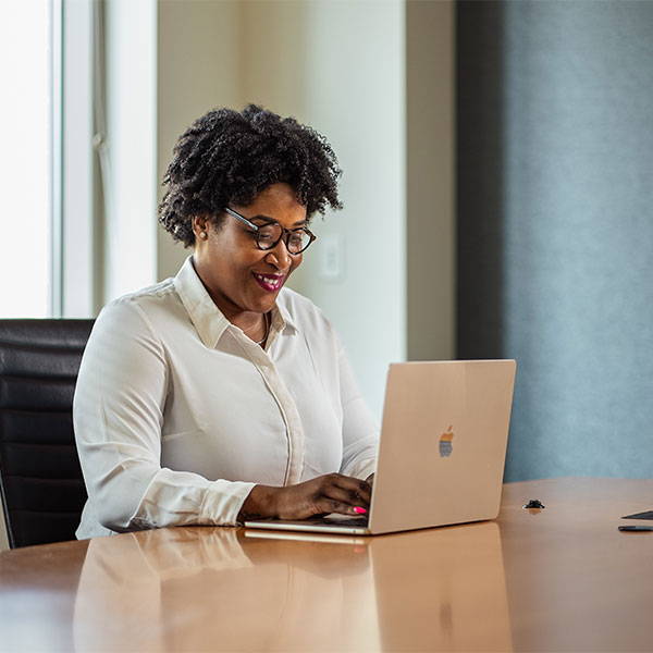 Scheller MBA student using a laptop.