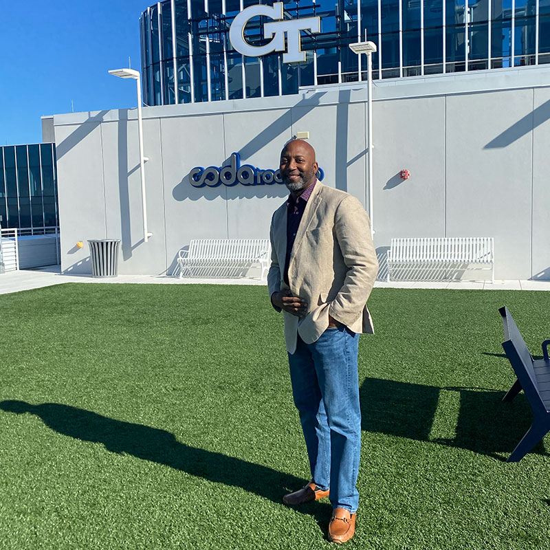 Jay Elliott standing on the CODA rooftop building in Atlanta