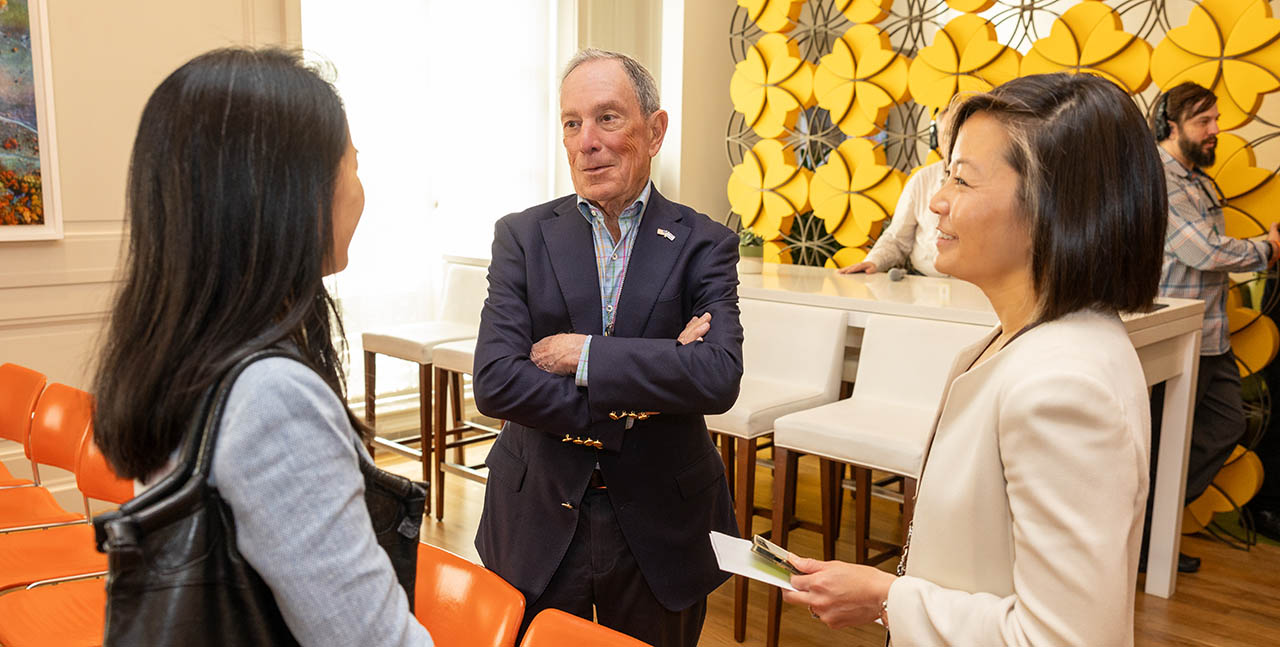 Michael Bloomberg chats with attendees