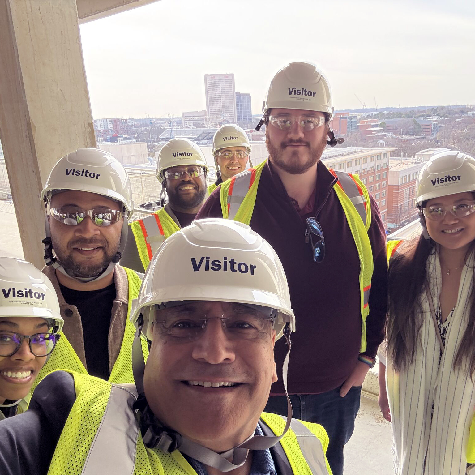 Dean Anuj Mehrotra and guests take a hard hat tour of Tech Square Phase 3