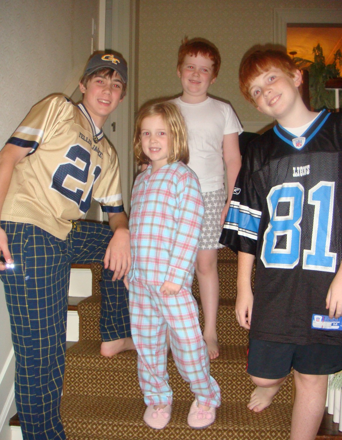 Wiley in his Calvin Johnson Tech jersey, siblings Annie, Collier, and Will (wearing his Calvin Johnson Detroit Lions jersey. 