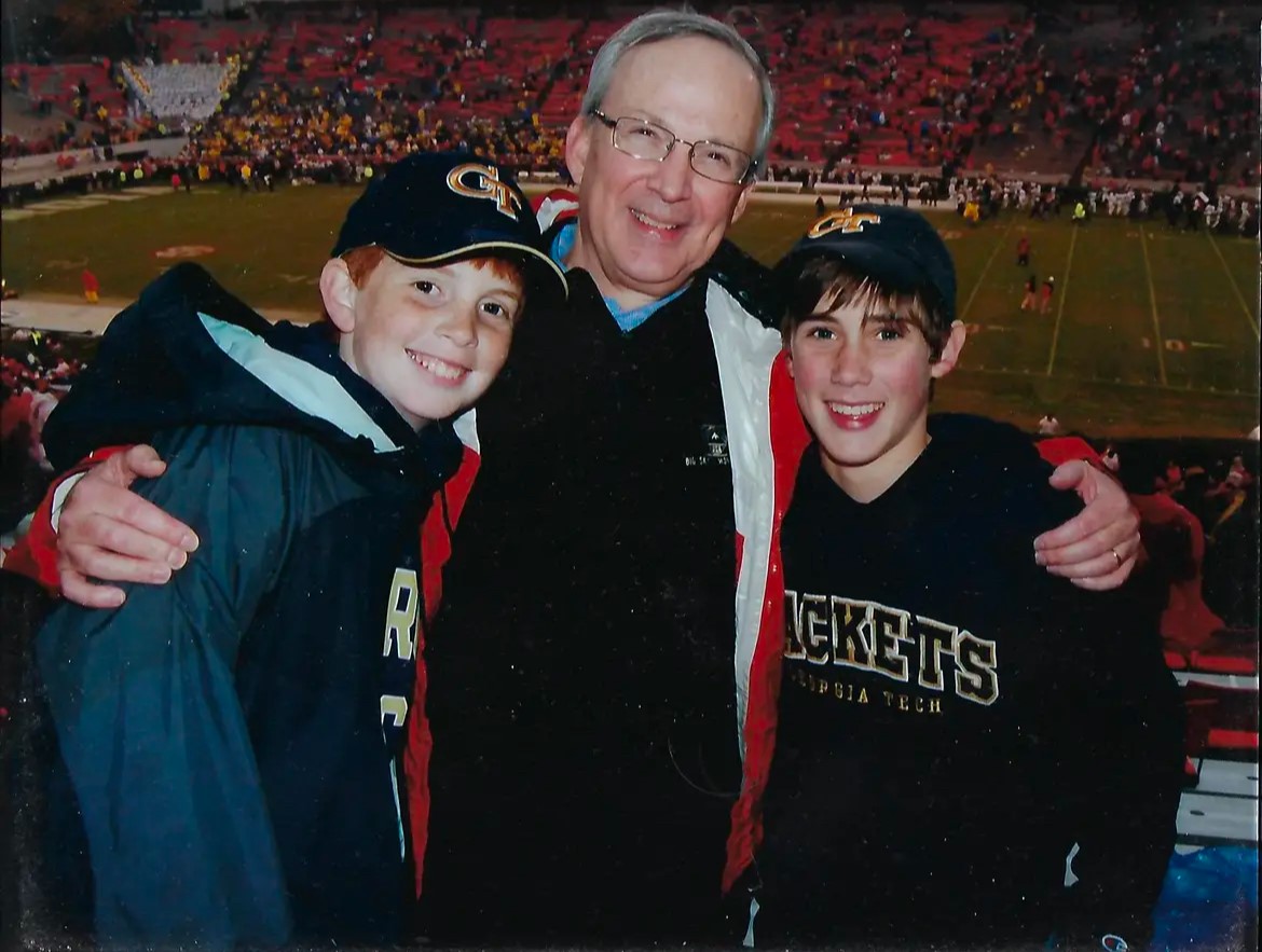 With his brother Will and his dad Perry.