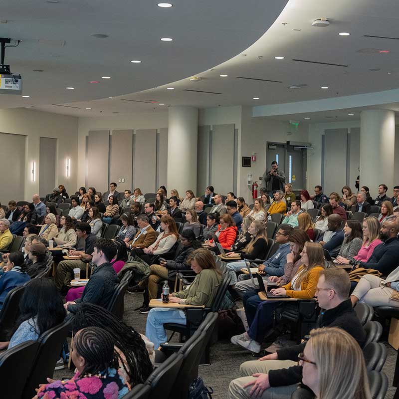 People sitting in the LeCraw Auditorium at Scheller for the Marketing Innovation Conference. 