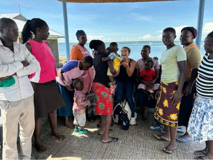 Amanda Ehrenhalt surrounded by the residents of Ndeda Island