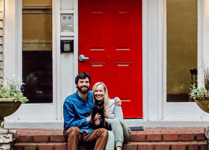 Tommy Bledsoe with his wife, Kelli, and cat, Brad.