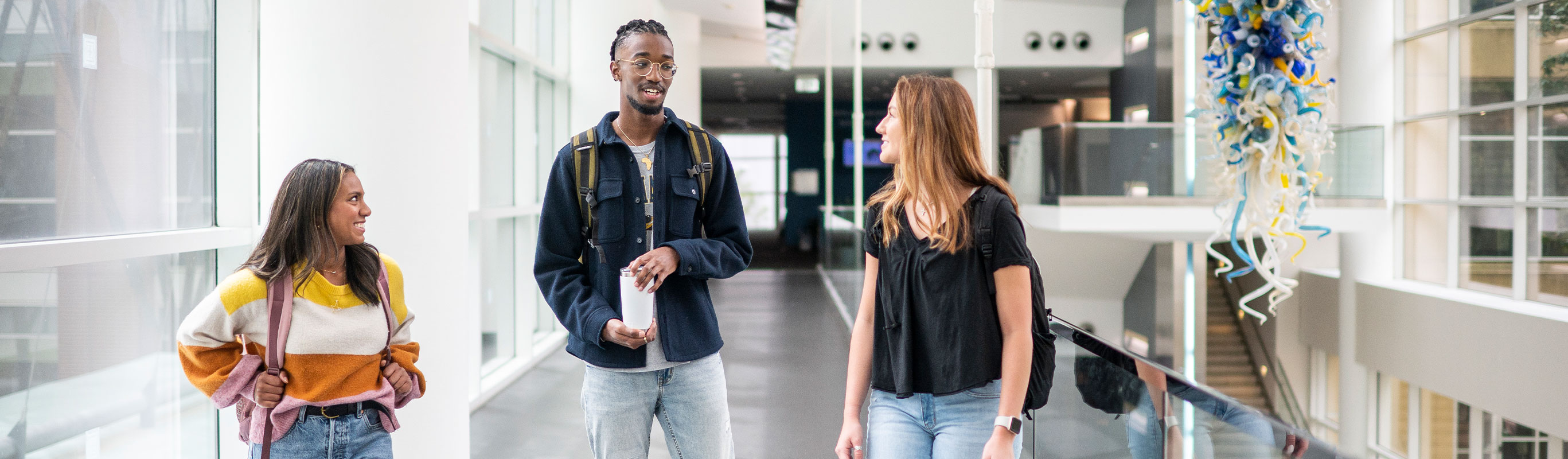 A Group of undergraduate students standing in an atrium